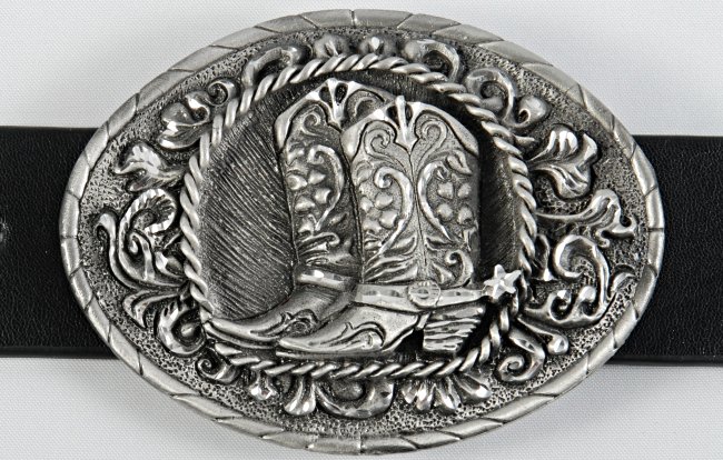 oval pewter western belt buckle with cowboy boots and spurs