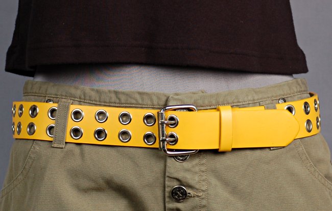 leather belt with double rows of metal eyelets, double prong roller buckle and plain leather retainer