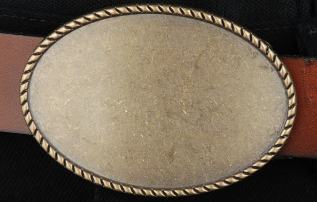 elongated oval antique brass western belt buckle with rope edge