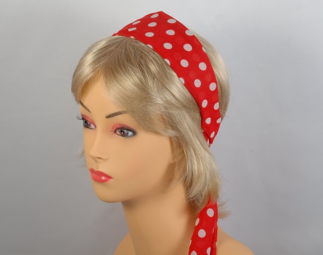 red headscarf with white polka dots attached to plastic headband