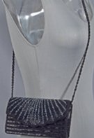 small black and grey beaded shoulder bag with long beaded strap, satin lined with zippered key pocket, magnetic clip