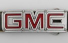 cut-out GMC logo belt buckle, tail light red letters and bolts