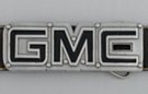 cut-out GMC logo belt buckle, black enamel letters and bolts