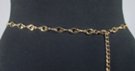 gold chain belt made of 29 inches of 7/16" wide oval G's and 14 inches of chain with singleton G at tip