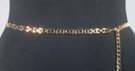 gold chain belt made of 29 inches of 3/8" wide lazy "H" block links and 14 inches of chain with heart pendant