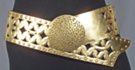 3" smooth wide belt with rivets and cut-outs; 3.5" circular distressed metal buckle; rides low on hips with extra long overhang