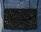 small beaded and sequined shoulder clutch with beaded loops on satin