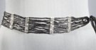 1-3/4" wide black bead sash, 24" of 10 string segments of colored beads, 6-1/2" braided ties, 12" tassles