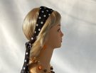 black polka dot head scarf with jewelry at sunset