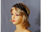 black cord crochet headband strung with cream, brown and coffee wooden beads on forehead, elastic in back