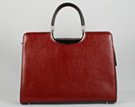 brief purse with detachable shoulder sling; zipper close
