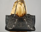 wide quilted tote with chains and Chanel-like insignia