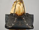 wide quilted tote with chains and Chanel-like insignia