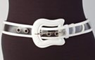 clear plastic fashion belt with white border and guitar-shaped buckle