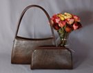 two-in-one: arch double shoulder purse with matching clutch/crossbody inside; more of an east-west design than our other frame purses