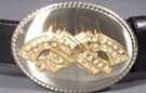 crossed pistols with rhinestones on oval buckle