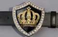 belt buckle, gold crown on black shield, edged by rhinestones