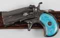 gunmetal derringer pistol belt buckle with blue perl handle