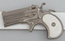 gunmetal derringer pistol belt buckle with white perl handle