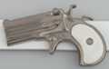 gunmetal derringer pistol belt buckle with white perl handle