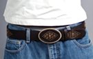 1-1/2" textured leather strap belt, diamond pattern of brass studs and eyelets with central amber stone on oval hook-style buckle, strap and tip