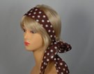 brown headscarf with white polka dots attached to plastic headband