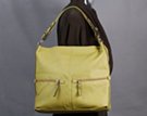 medium duffle with double front horizontal zipper pockets and black bead accented side and shoulder straps; nickel ball buttons for adjustable strap
