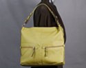 medium duffle with double front horizontal zipper pockets and black bead accented side and shoulder straps; nickel ball buttons for adjustable strap