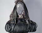 black ruched teardrop east-west handbag with U-bolt ornaments