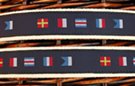 fabric web belt with leather tabs, gold-tone buckle, attached navy blue strip with embroidered maritime signal flags
