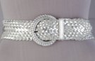 wide faux leather braided glitter belt with circular braided buckle