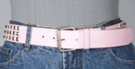 pink 1-1/2" leather strap belt with triple row of pyramid metal studs, rectangular roller buckle and leather retainer