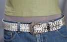 white 1-1/2" leather strap belt with central row 1/2" white rhinestones banked by double rows of knob studs, western-style cast squash blossom buckle and keeper