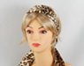 gold and black leopard skin pattern headscarf attached to plastic headband for fall fashion