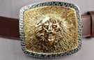 3-D lion's head, face and mane, Aztec border; gold-tone on silver