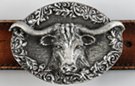 oval pewter belt buckle, Texas longhorn head on wood texture with leaf work
