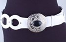 wide white loops with studs, big silver disk and black stone western-style buckle