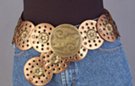 bronze PVC discs with eyelets and concho leafed together tipped by etched medallion hook buckle