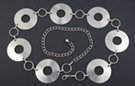 wide silver chain belt, "mini CD" disks and rings