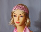 pink cord crochet headband strung with cream, brown and coffee wooden beads on forehead, elastic in back