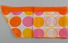 chiffon belt scarf with pink, orange and yellow disks and circles on white with orange border
