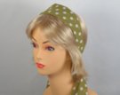 olive green headscarf with white polka dots attached to plastic headband