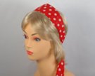 red headscarf with white polka dots attached to plastic headband