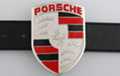 Porsche crest on shield-shaped belt buckle