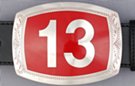 rectangular belt buckle, "13" on red field and chrome border