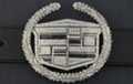 rhinestone and chrome belt buckle with Cadillac crest and wreath