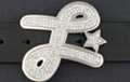 rhinestone script "L" with star belt buckle