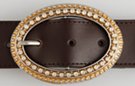 oval center bar buckle rimmed with chrome pebbles and rhinestones