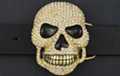 rhinestone studded gold-tone skull belt buckle