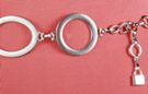 silver ring and oval chain belt